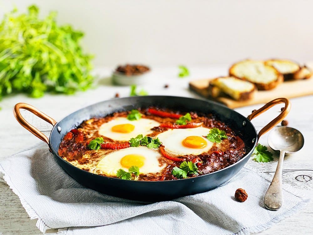 Shakshuka with Native Bush Tomato & Aniseed Myrtle served with Grilled Saltbush & Goats Cheese Sourdough